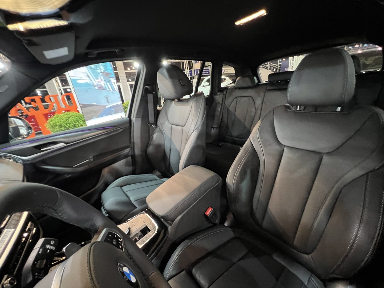 Black leather seats and modern dashboard in luxury SUV interior