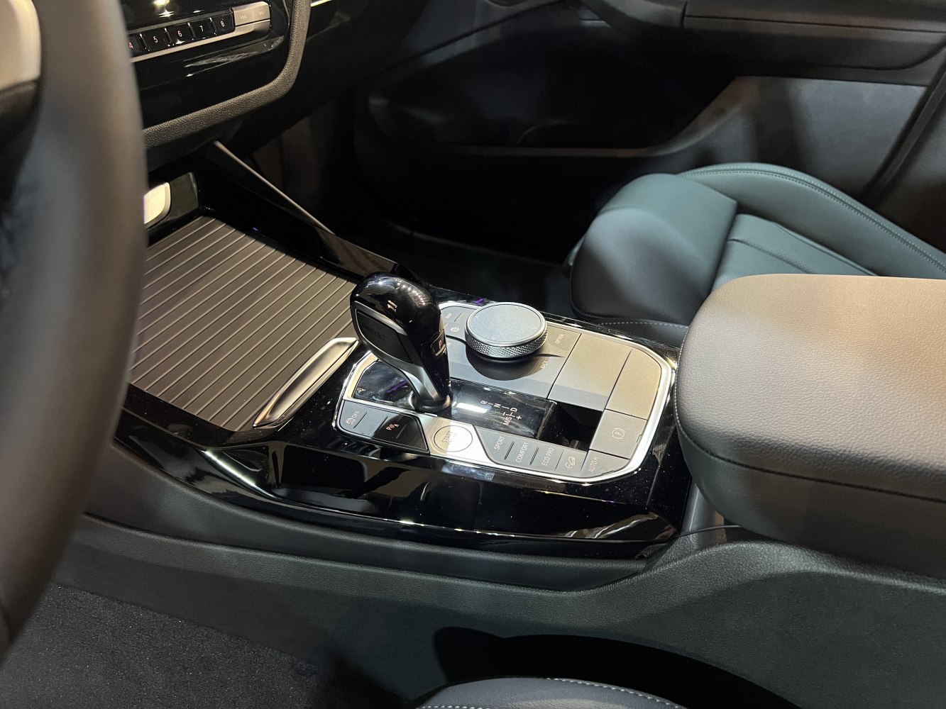 Center console with gear shifter and control dial