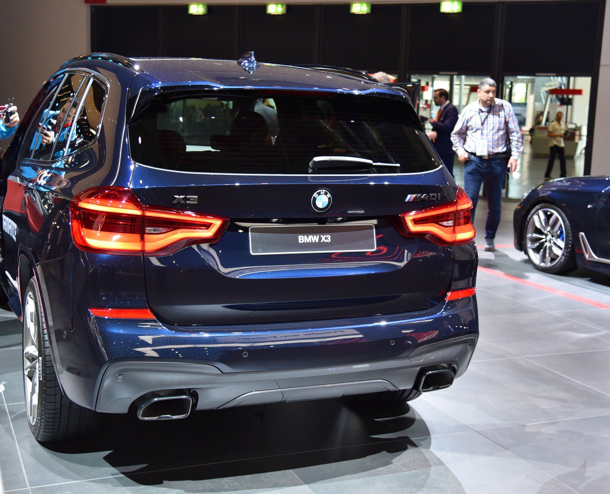 Rear view with LED tail lights and dual exhaust.