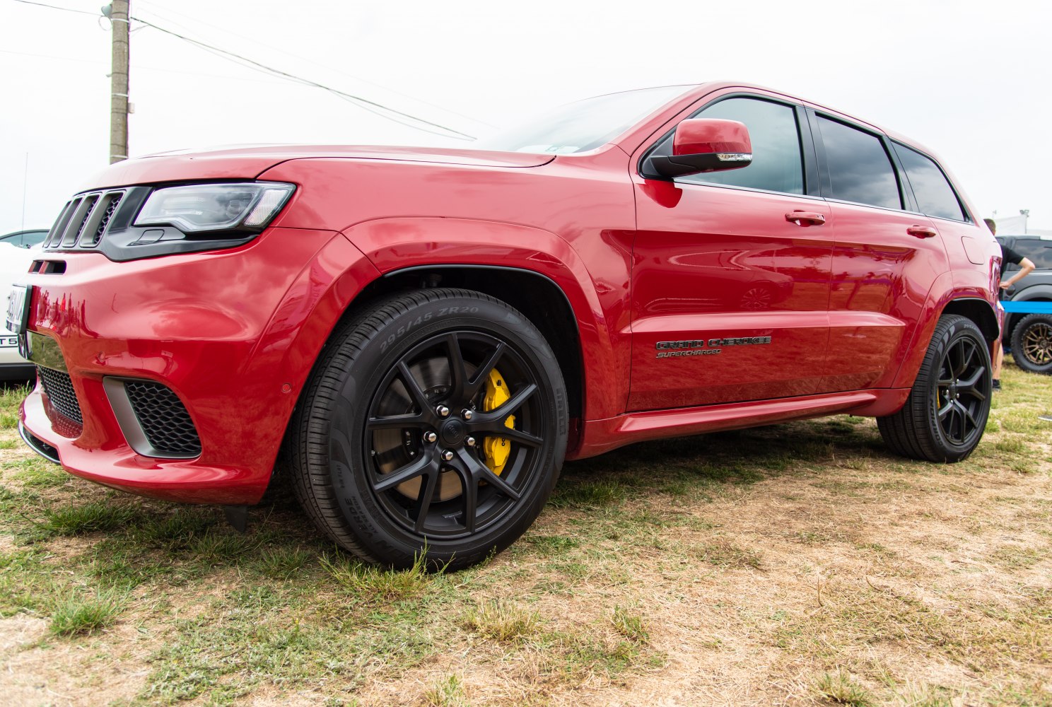 Red SUV with black alloy wheels and yellow brake calipers