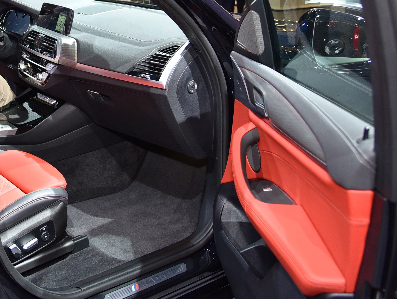 Red leather seats and modern dashboard with display