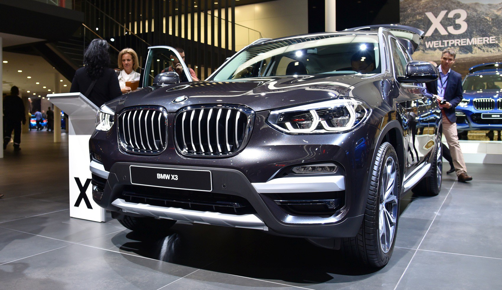 Close-up of SUV front with kidney grille and LED headlights