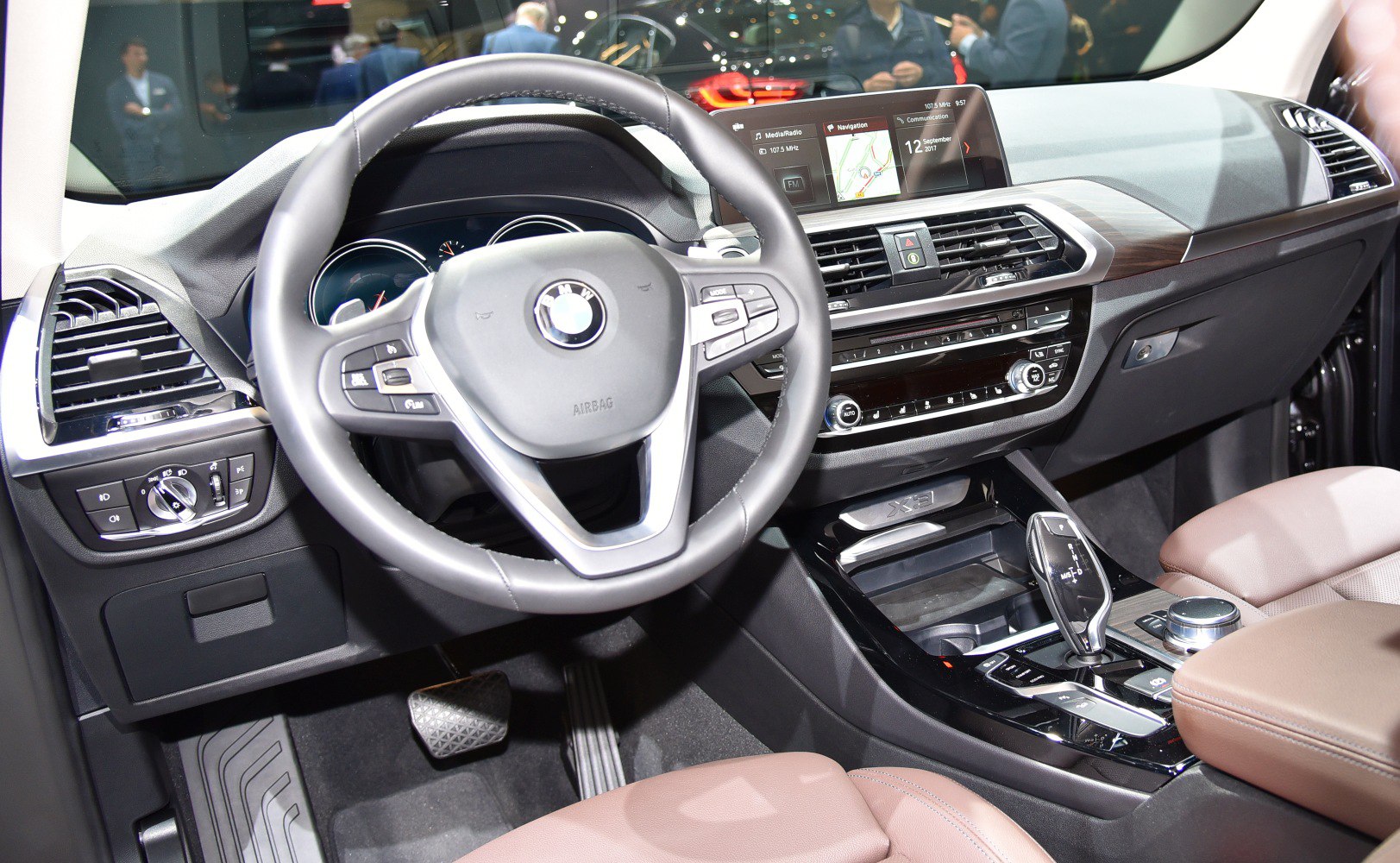Interior dashboard and steering wheel with navigation screen and gear selector