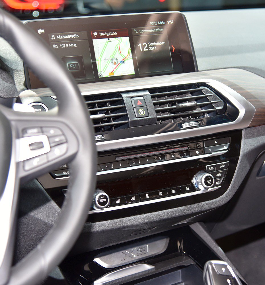 Dashboard with navigation screen, air vents, and climate control panel