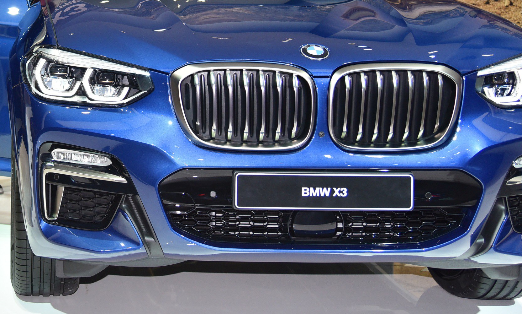 Close-up of BMW kidney grille and LED headlights