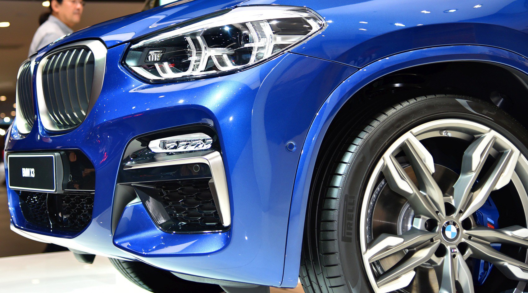 Front headlight and alloy wheel close-up with sporty design
