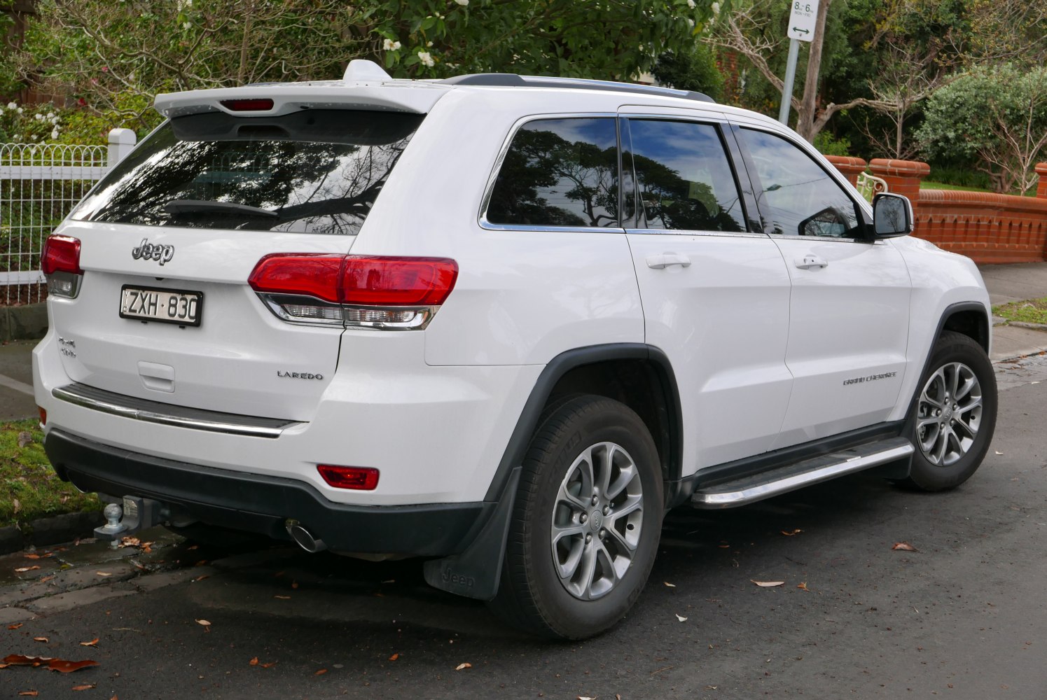Rear and side view with tail lights and alloy wheels