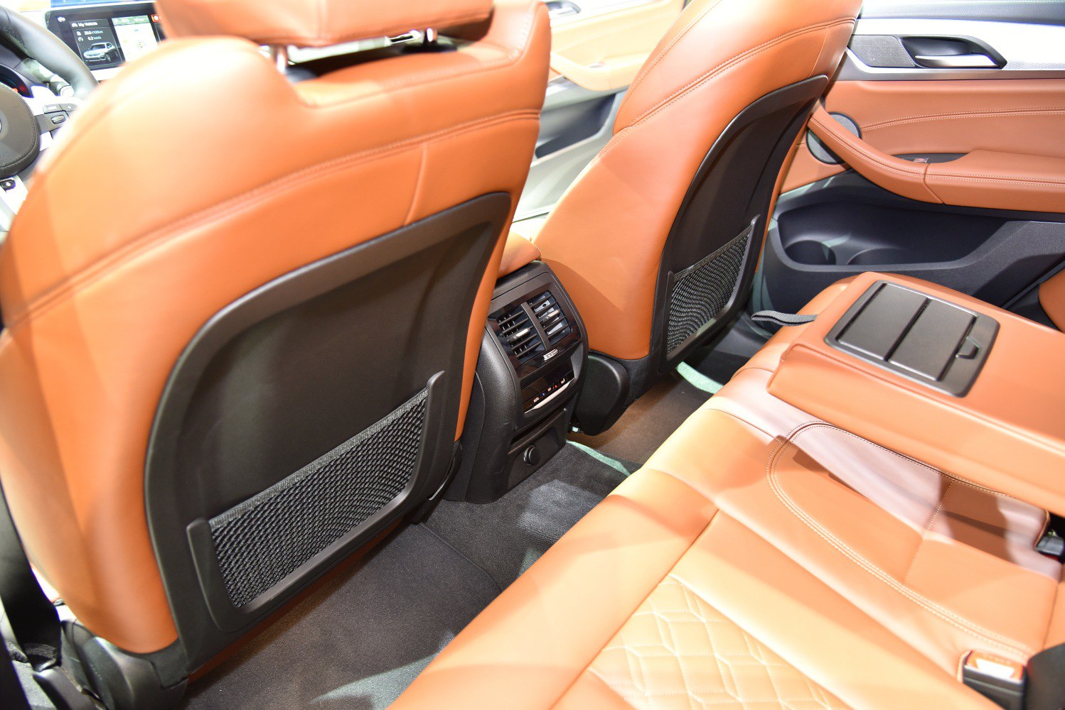 Rear seat interior with leather upholstery and rear climate control vents