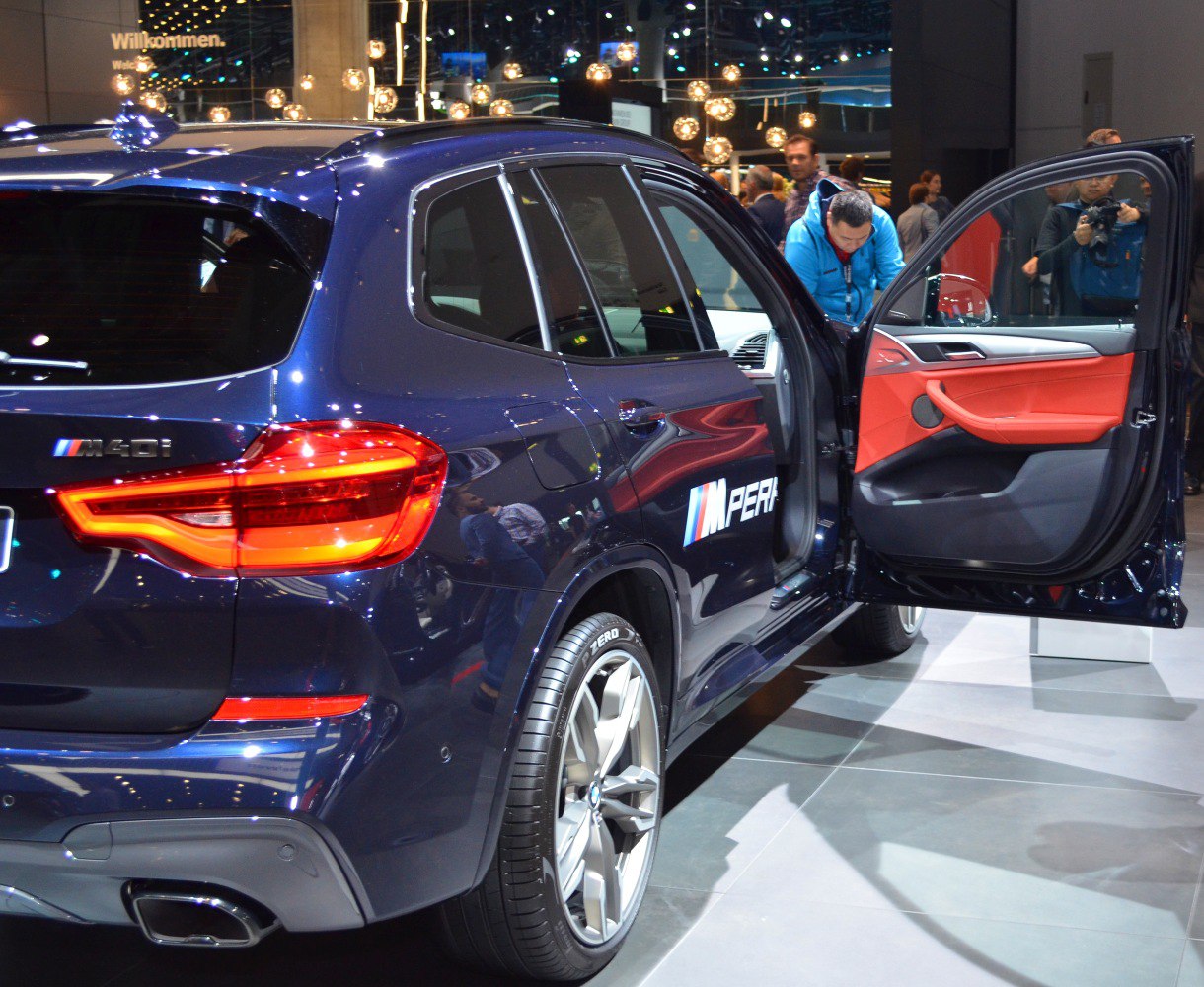 Rear view of SUV with LED tail lights and red interior door