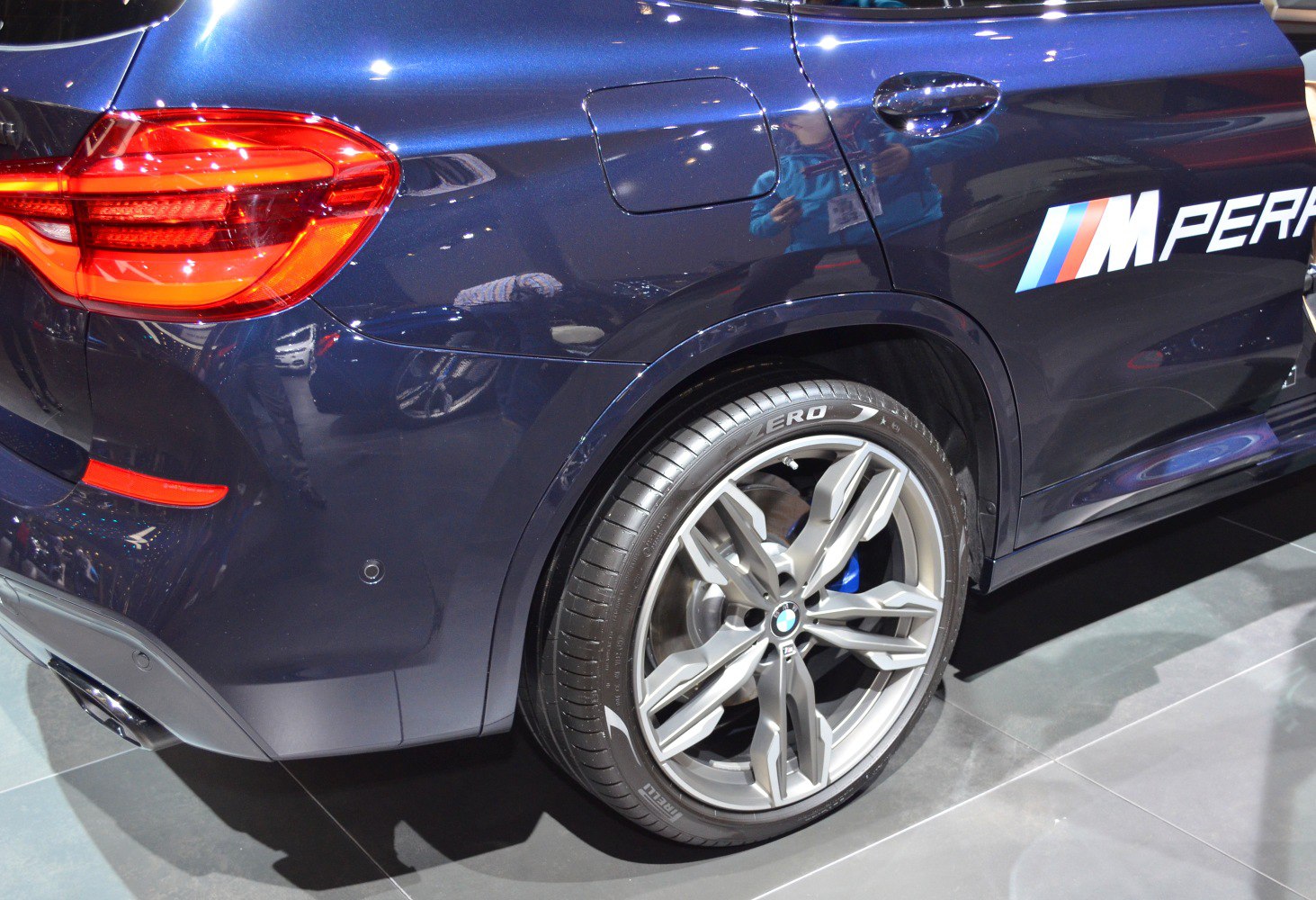 Rear side with alloy wheel, taillight, and M Performance badge