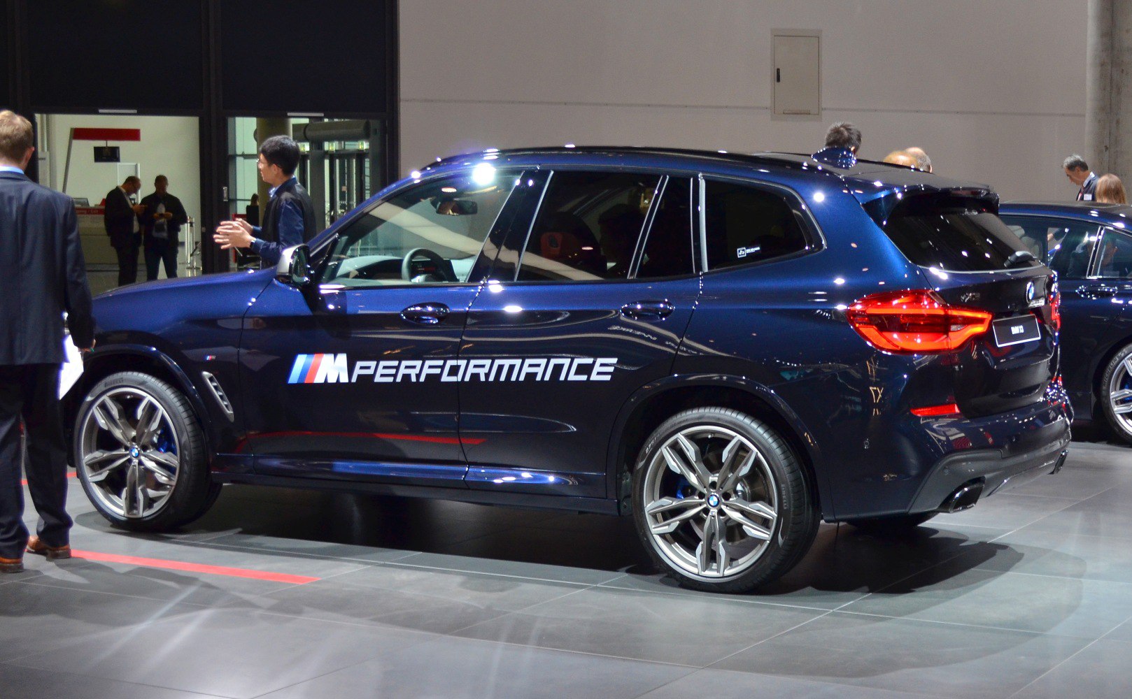Sporty SUV side profile with M Performance logo and alloy wheels