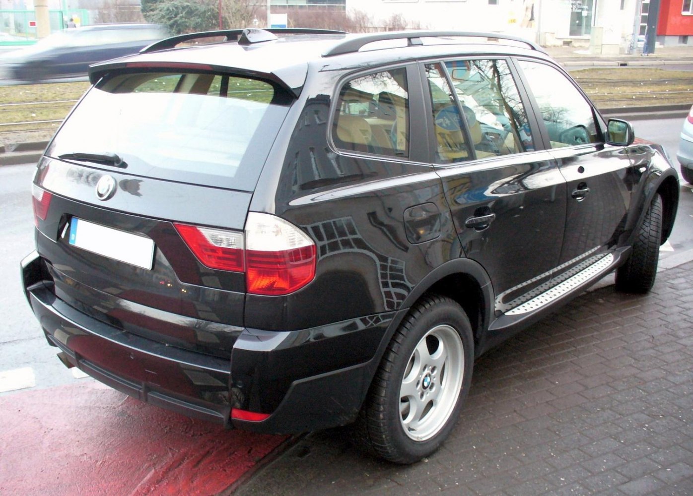 Rear and side view with roof rails and alloy wheels