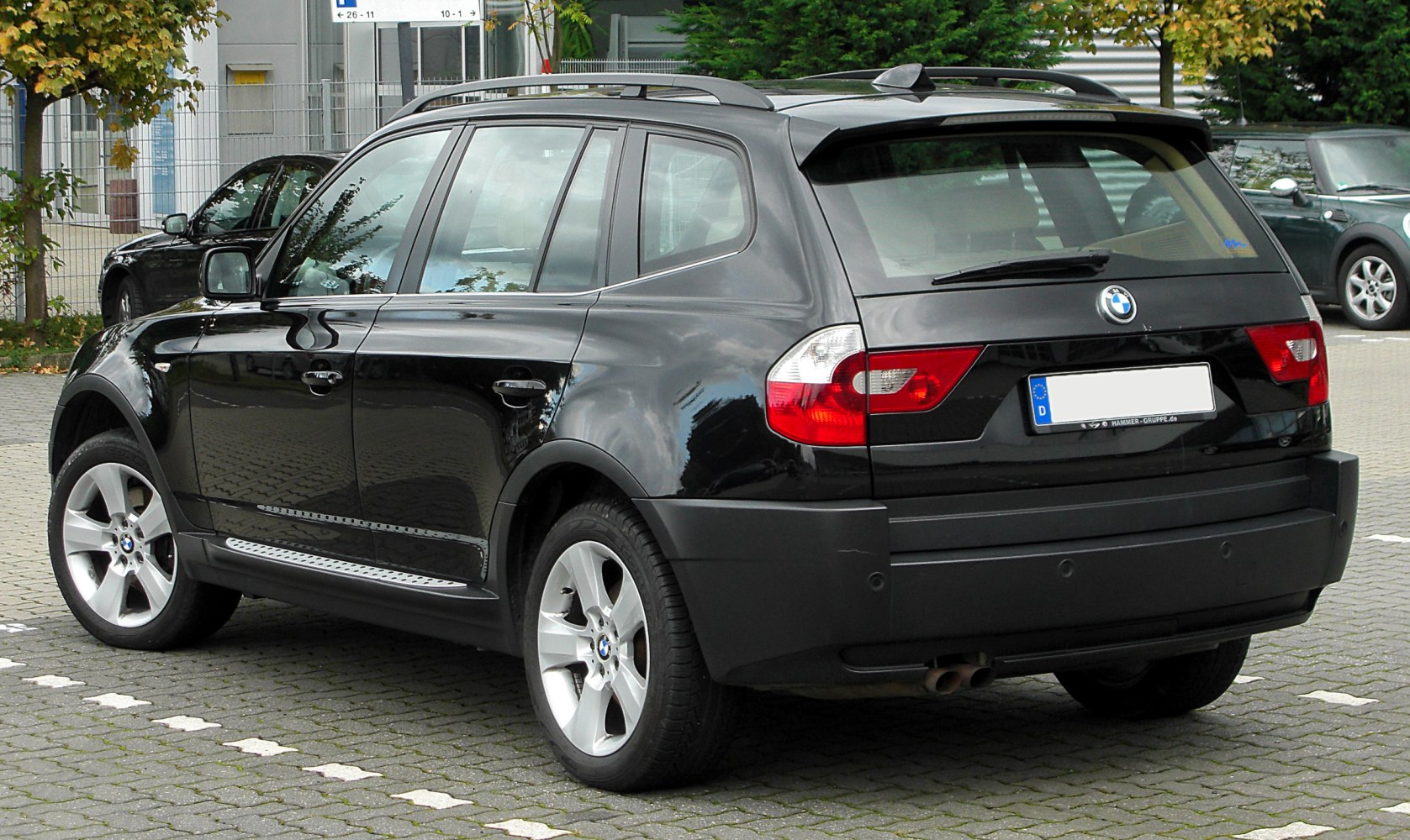 Rear side view of SUV with roof rails and alloy wheels