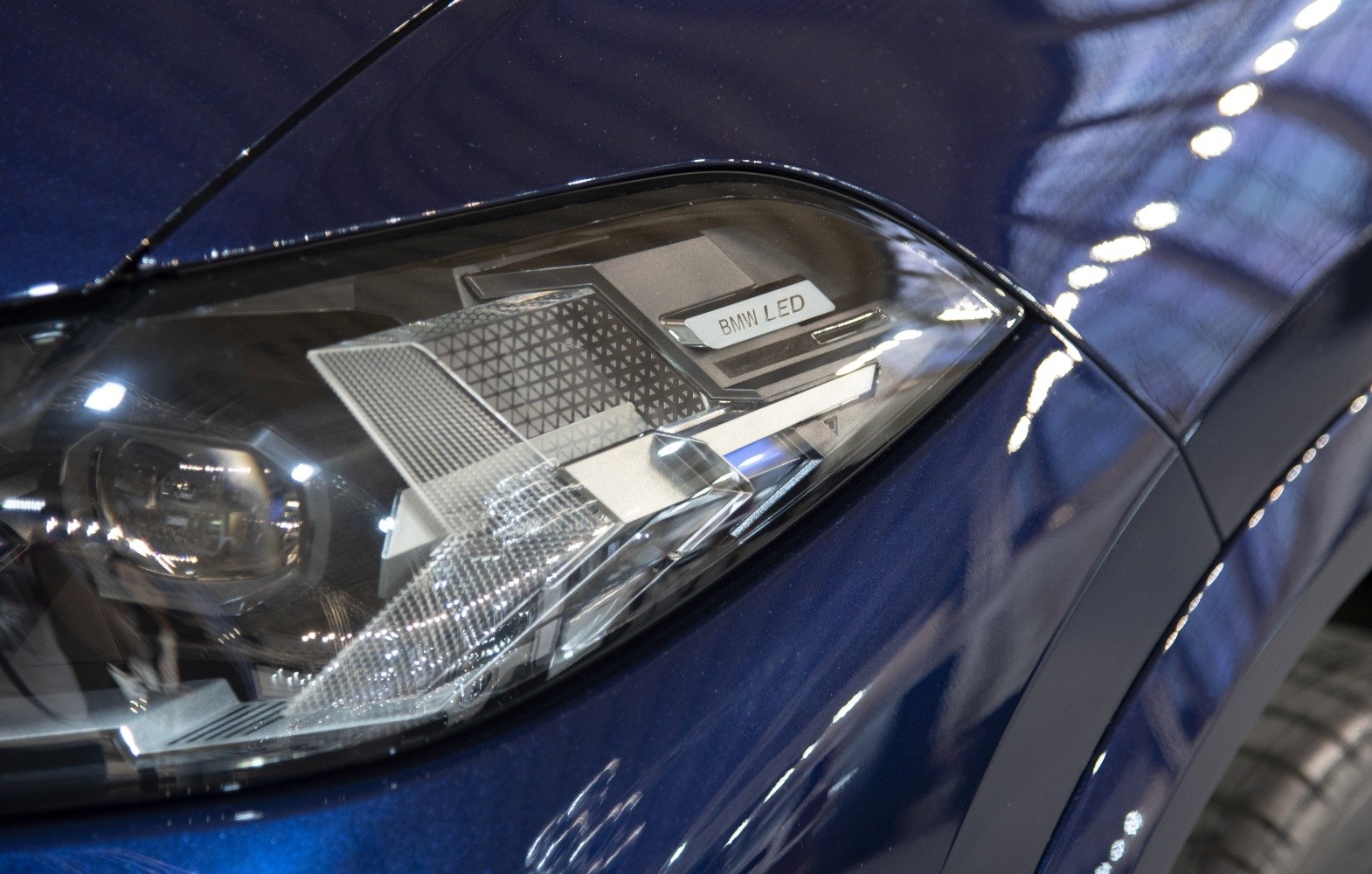 Close-up of front LED headlight with intricate design details