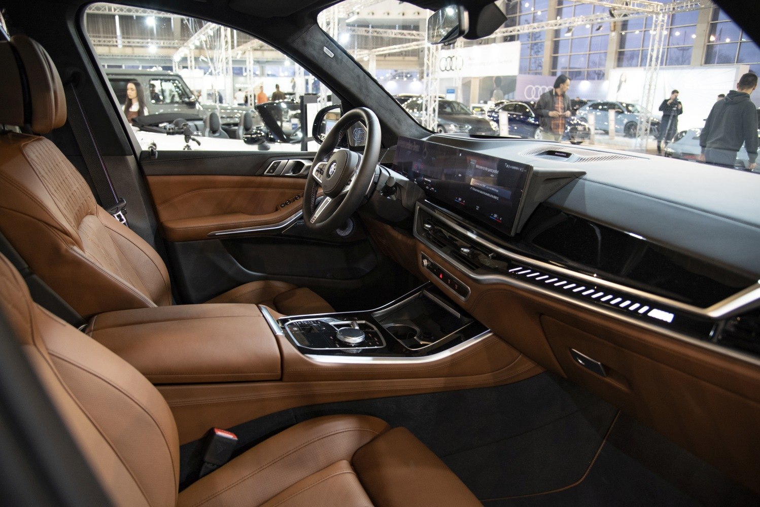 Brown leather seats and digital dashboard with ambient lighting