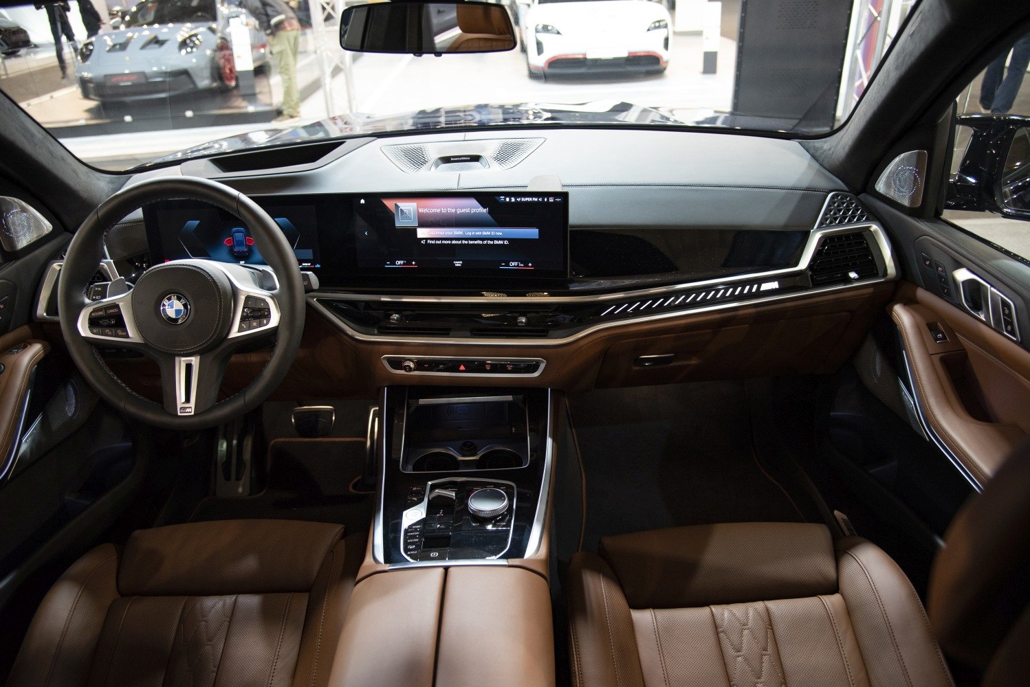 Digital instrument cluster and infotainment display with brown leather seats