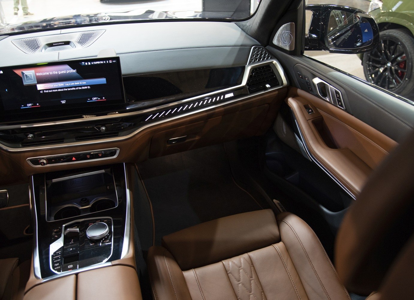 Luxury brown leather seats, touchscreen infotainment, ambient lighting