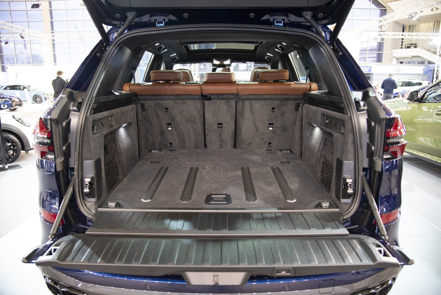 Roomy SUV cargo space with brown leather seats and panoramic roof