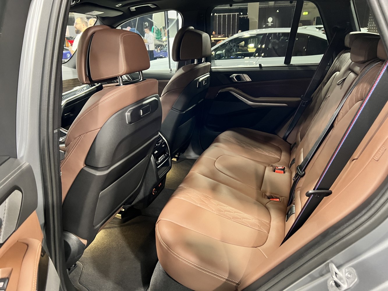 Rear seat interior with brown leather upholstery and spacious comfort