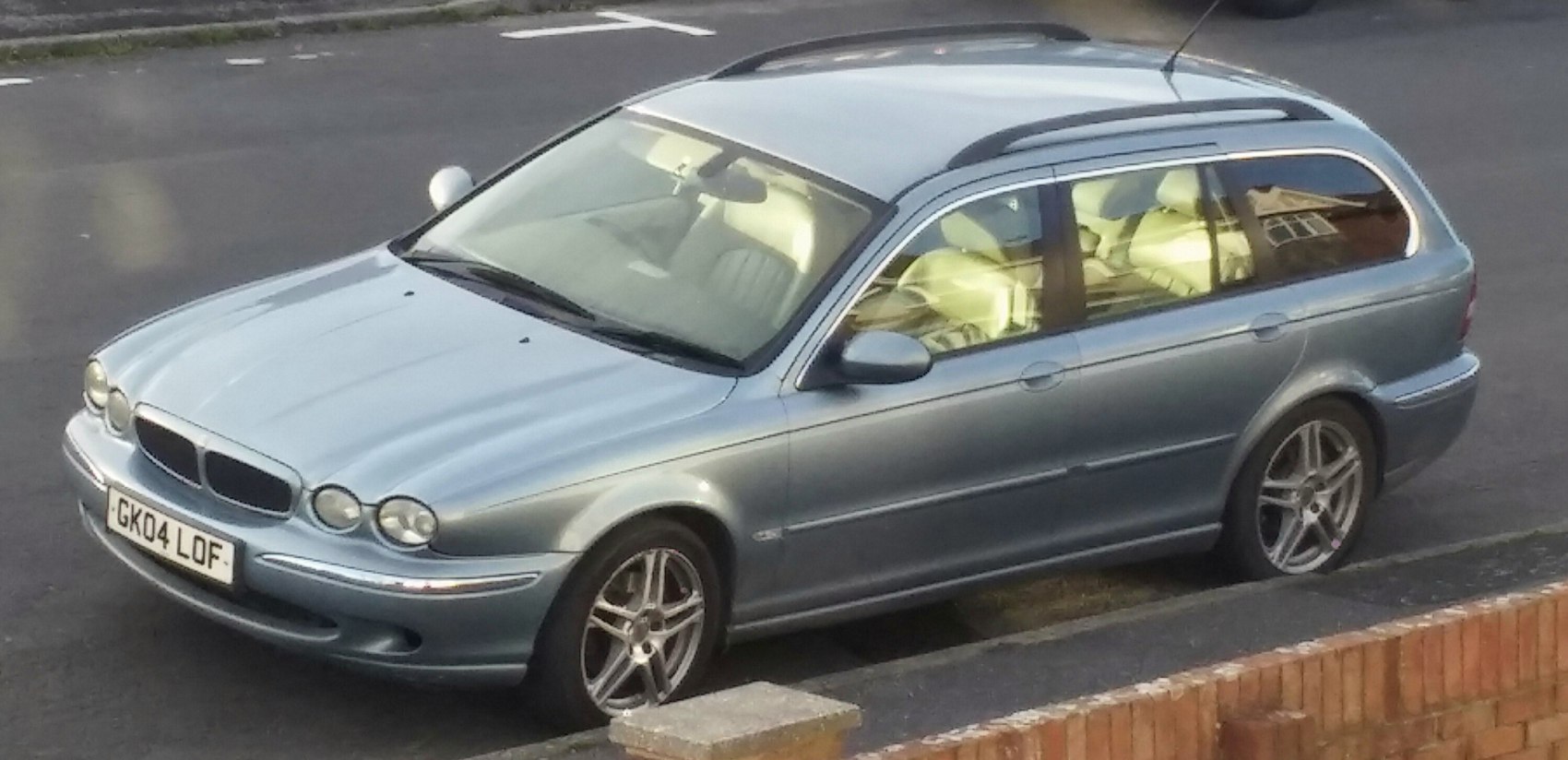 Silver station wagon with alloy wheels and roof rails