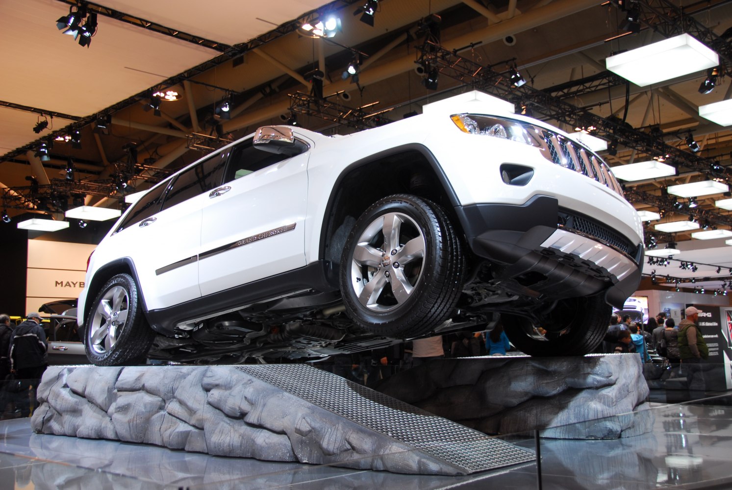 SUV on off-road ramp showcasing alloy wheels and high ground clearance