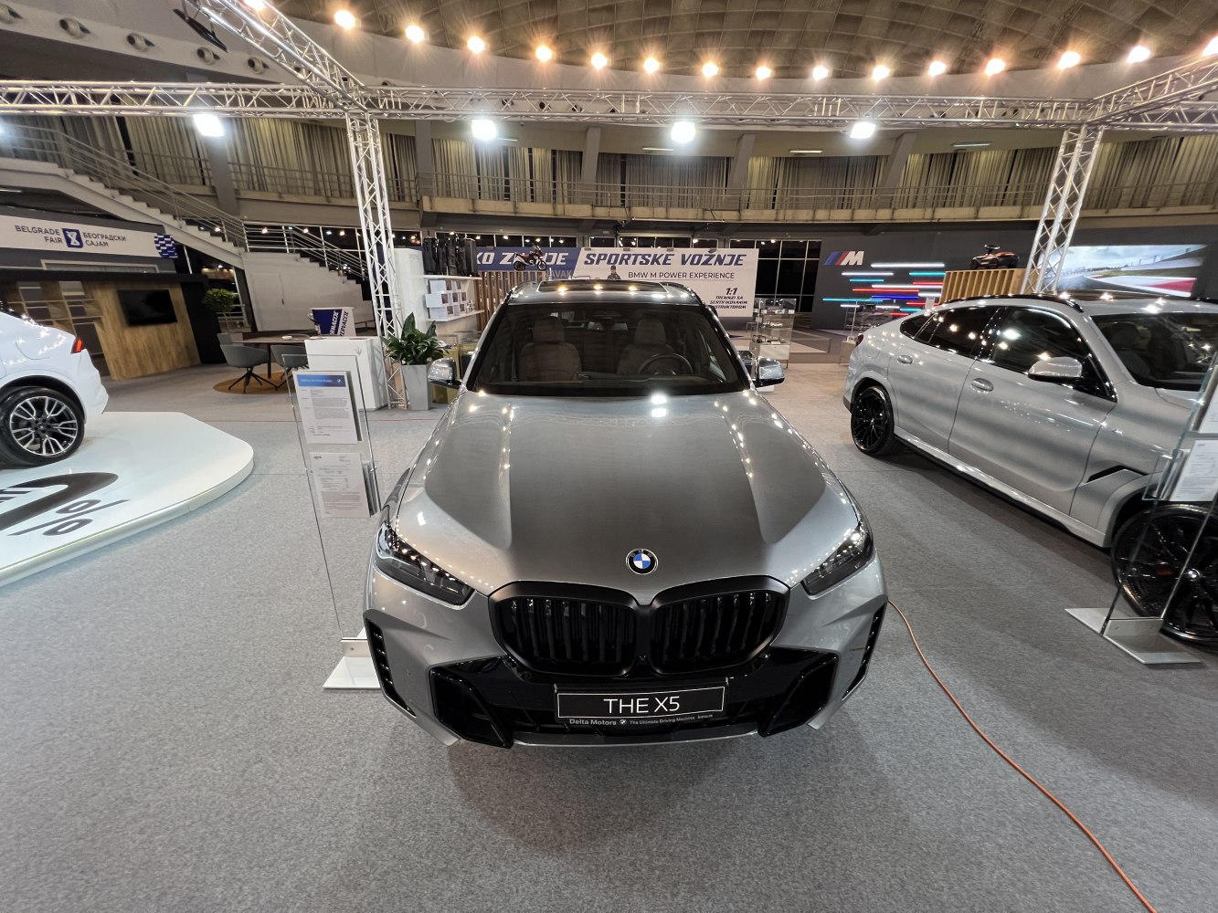 Front view of a facelifted luxury SUV with distinctive grille and headlights