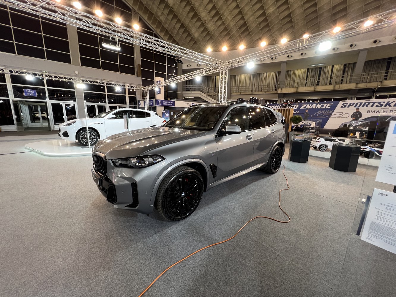 Aerodynamic SUV with aggressive front and black alloy wheels