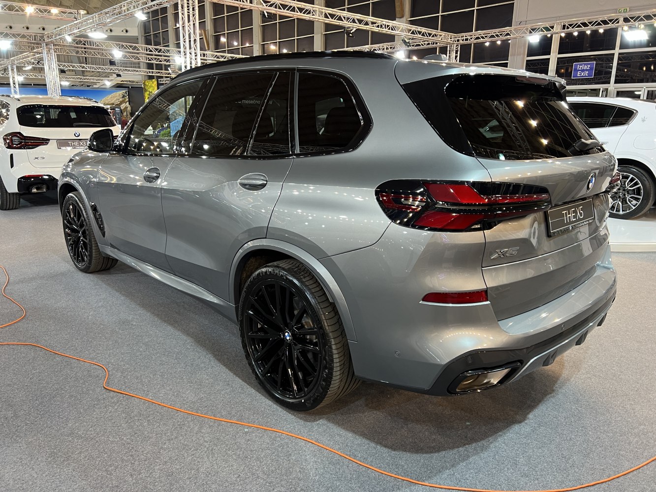 Rear and side view of an SUV with black wheels and sleek taillights