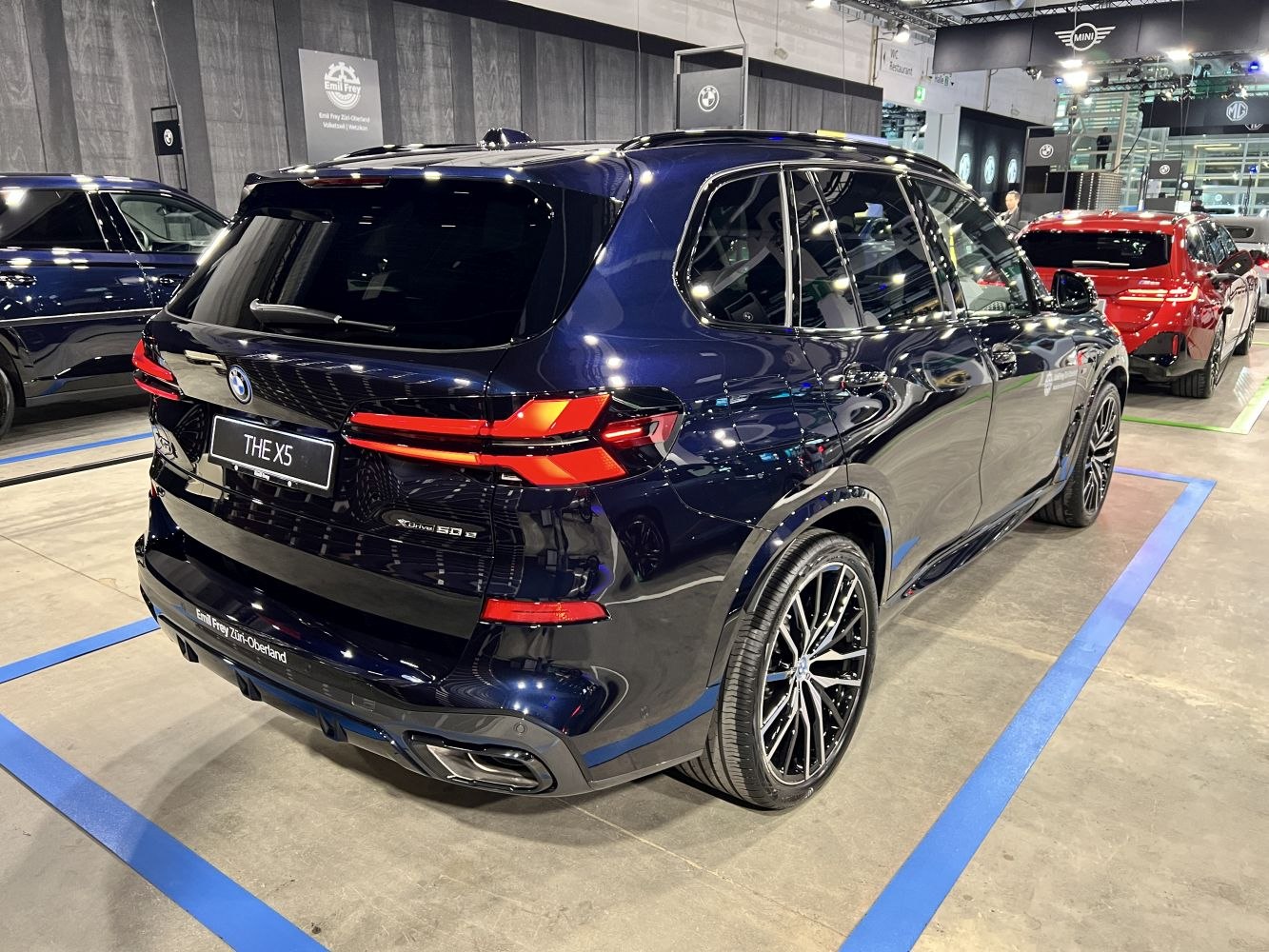 Rear view with LED tail lights and dual exhaust of a modern SUV