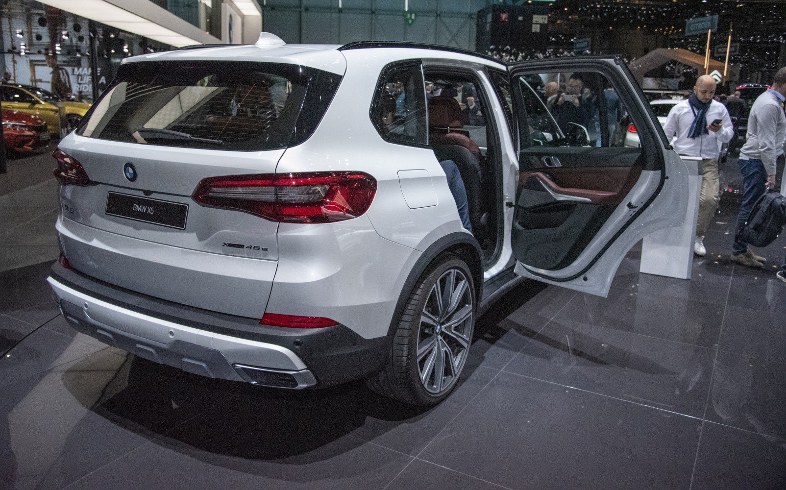 Rear view with open rear door of luxury SUV