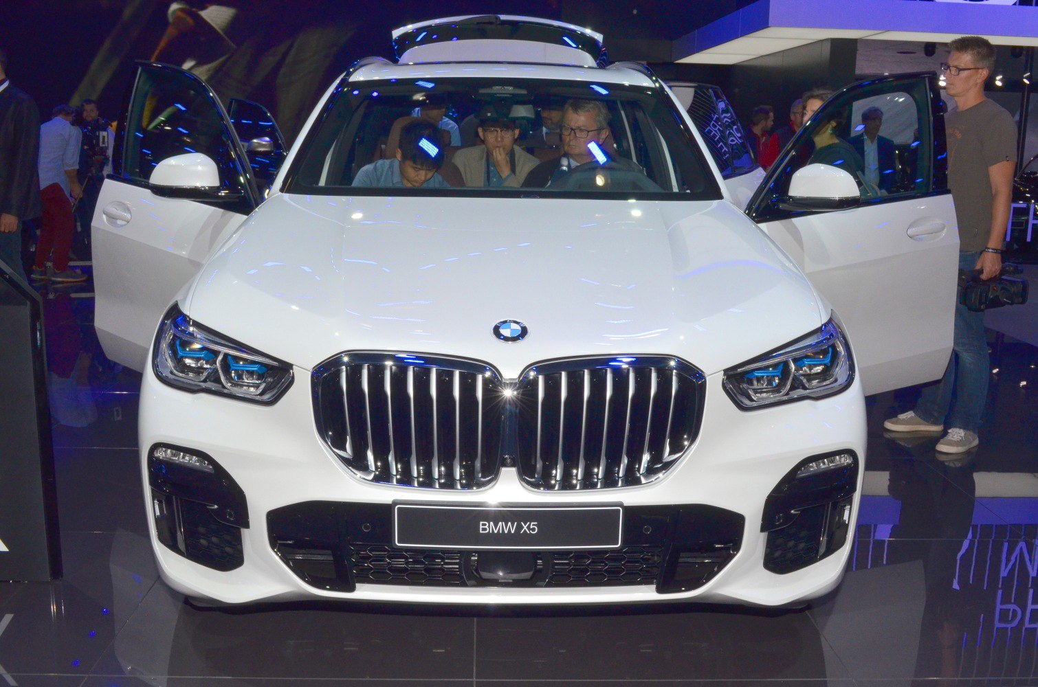 Front view with kidney grille, LED headlights, and open doors
