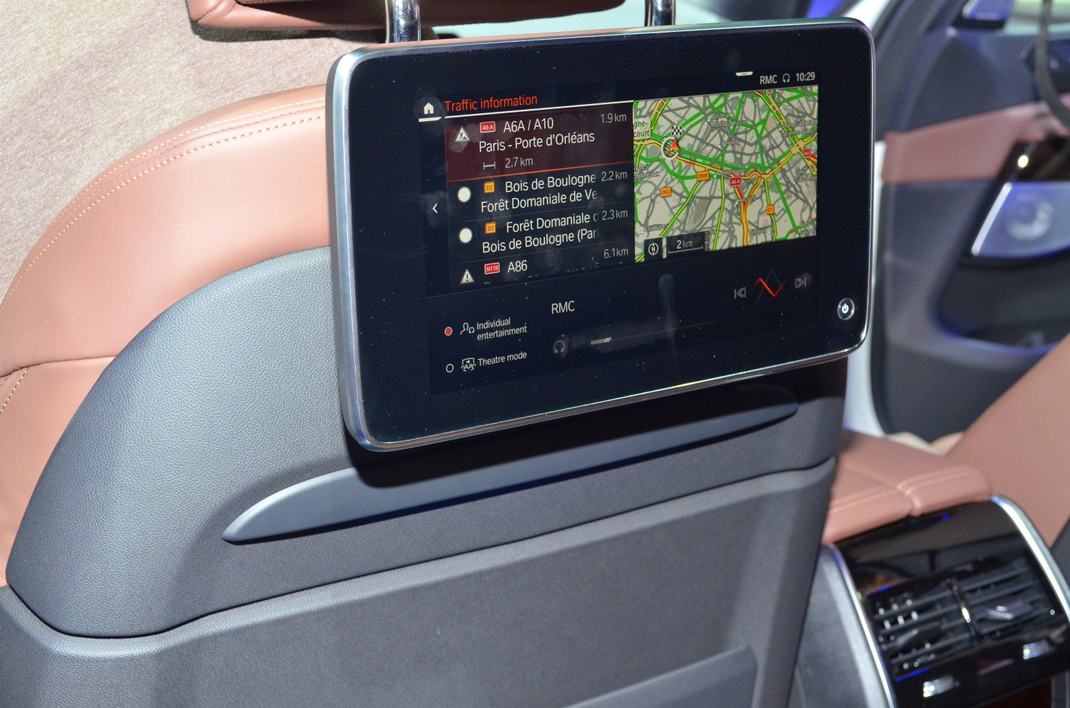 Rear seat multimedia navigation display with traffic info on luxury SUV interior