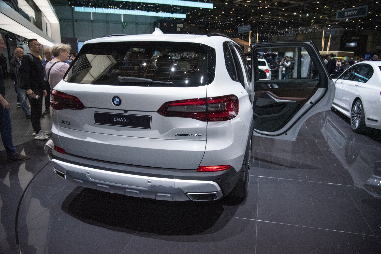 Rear view of SUV with open rear right door and LED tail lights