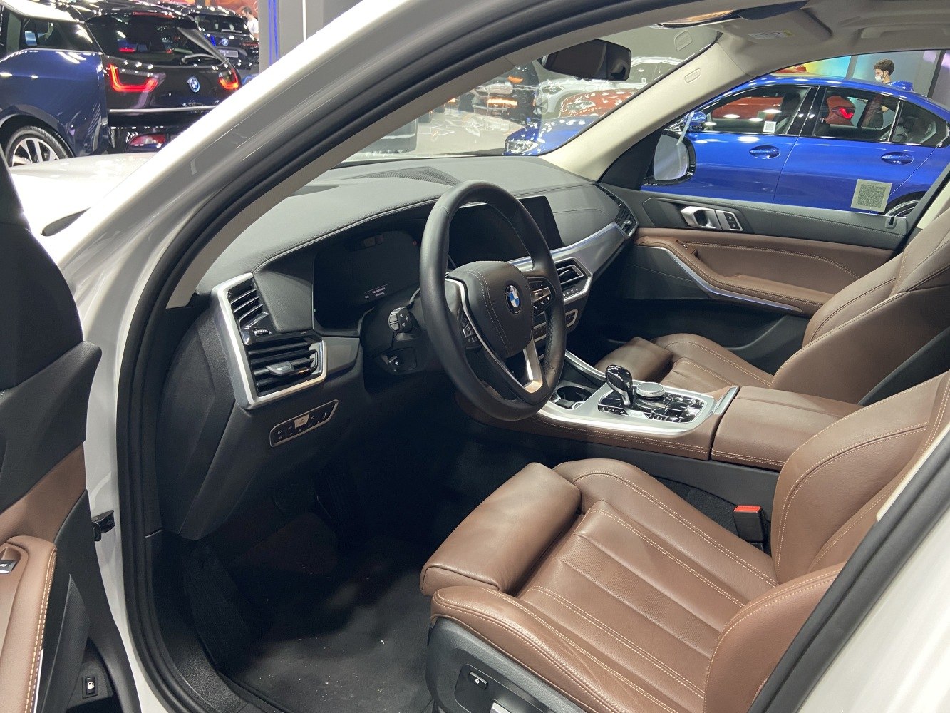 Luxurious brown leather seats and modern dashboard with center console.