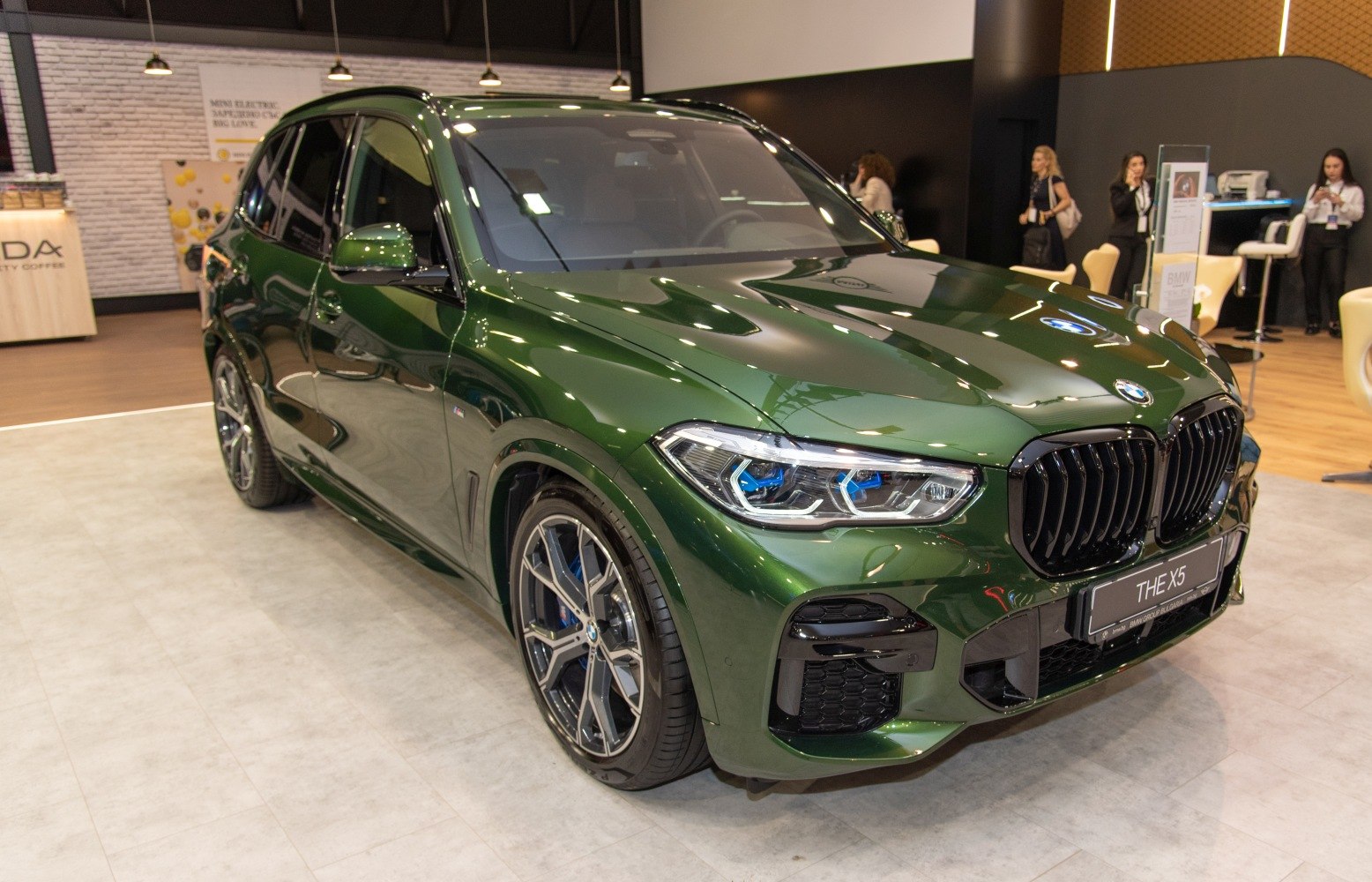 Dark green SUV with sporty alloy wheels and LED headlights