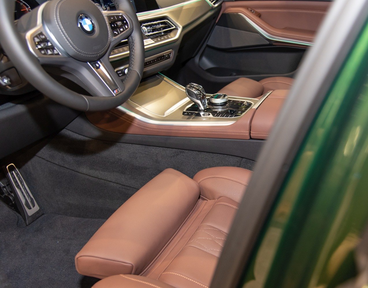 Luxury brown leather seats and modern dashboard controls