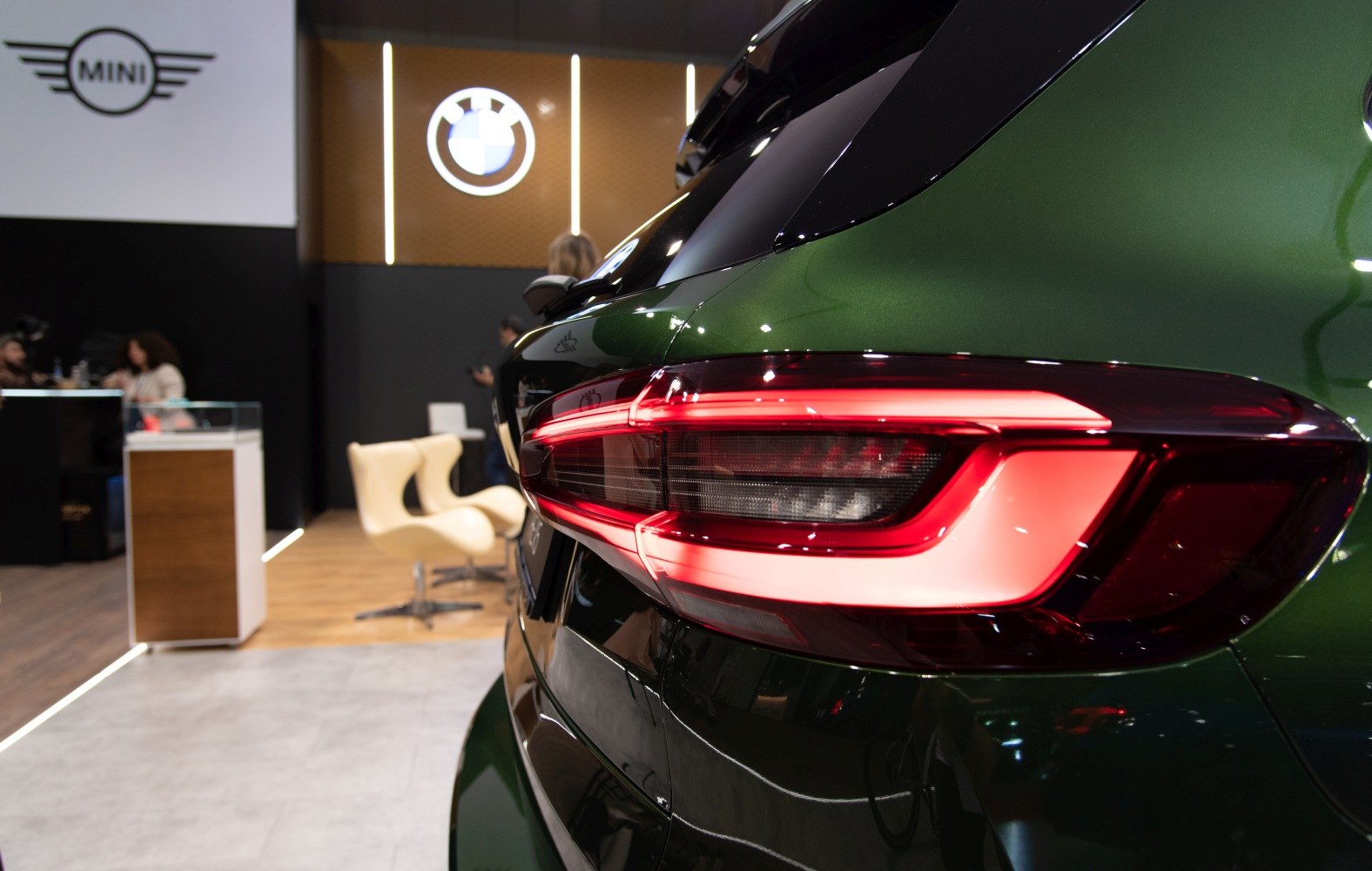 Close-up of rear LED tail light on dark green SUV