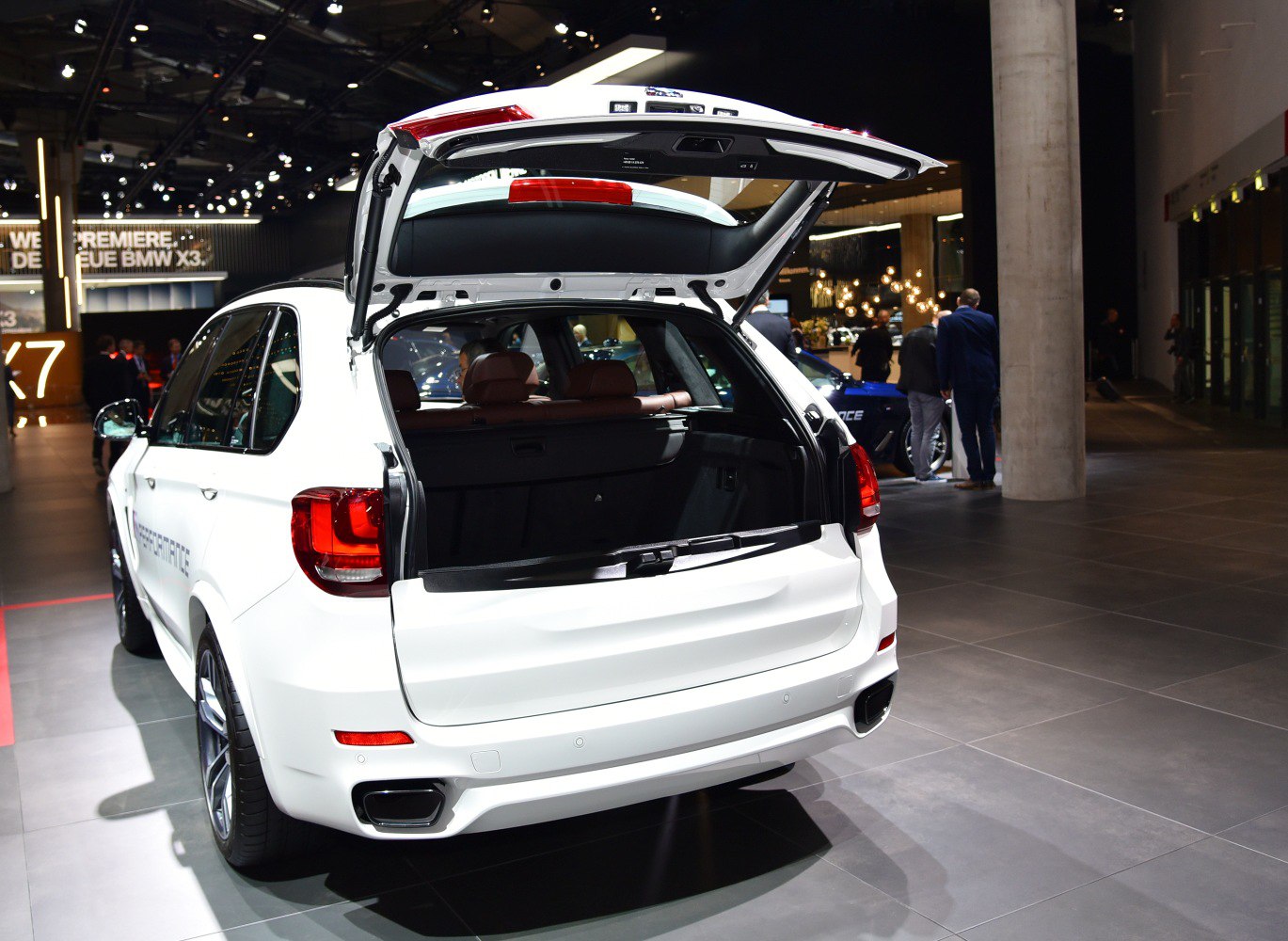 Open rear trunk with spacious cargo area in a modern SUV.