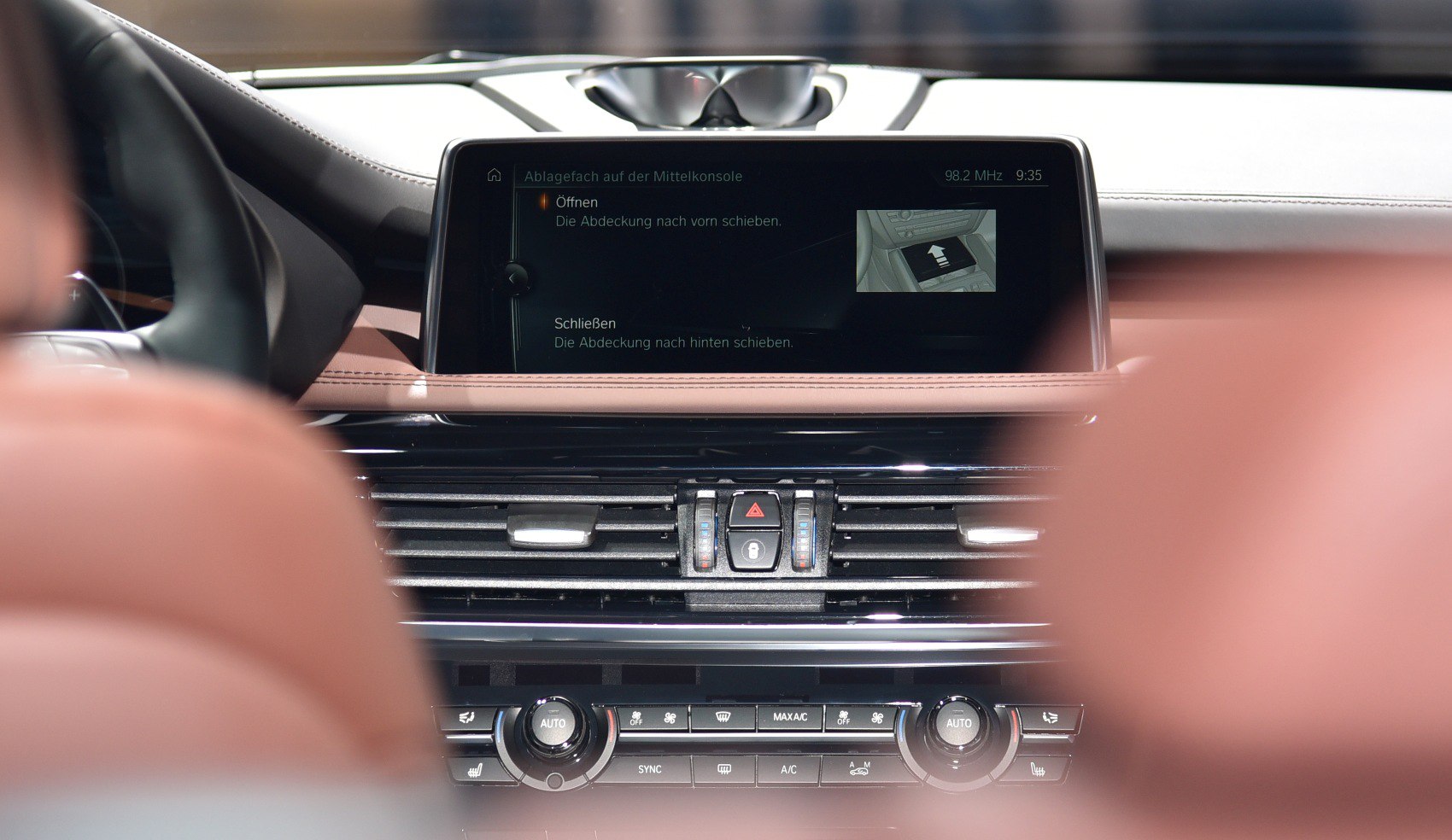Dashboard infotainment screen and climate control panel with air vents