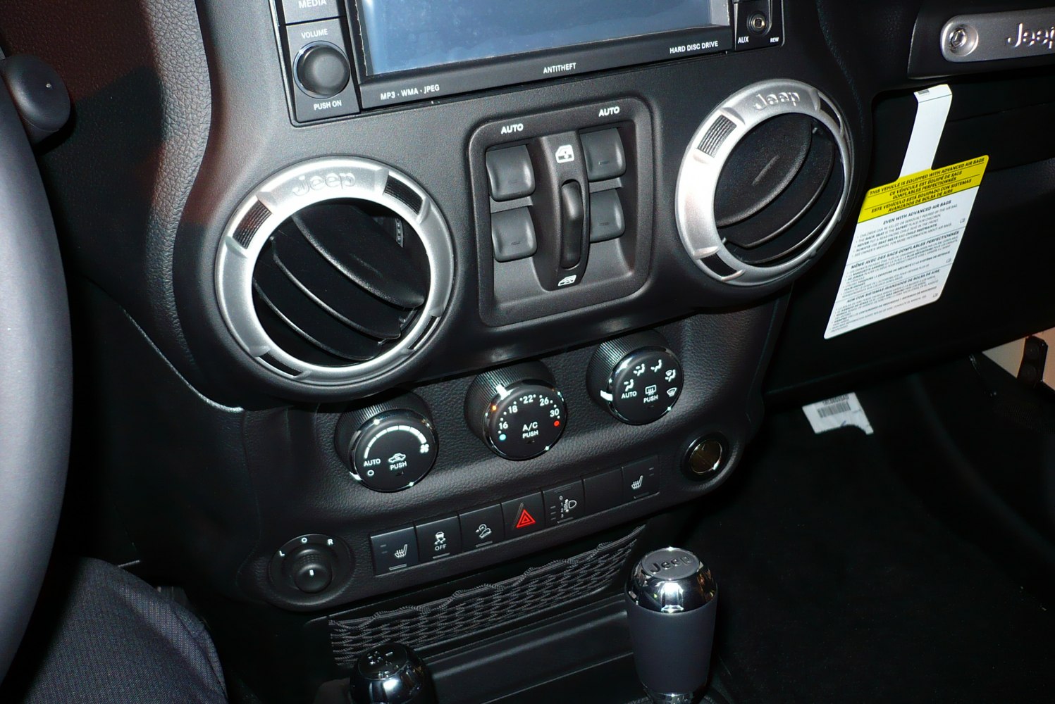 Dashboard air vents and climate control knobs with Jeep branding