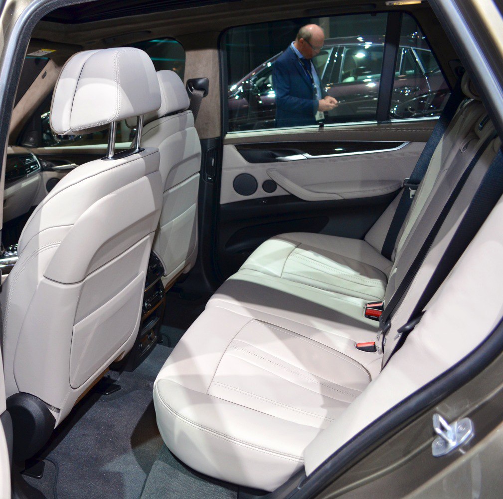 Rear interior with beige leather rear seats and door panel