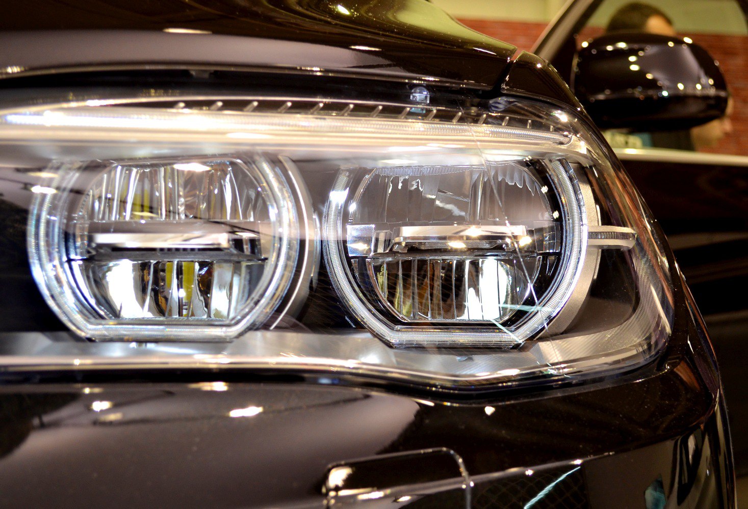 Close-up of modern dual LED headlight assembly with chrome detailing