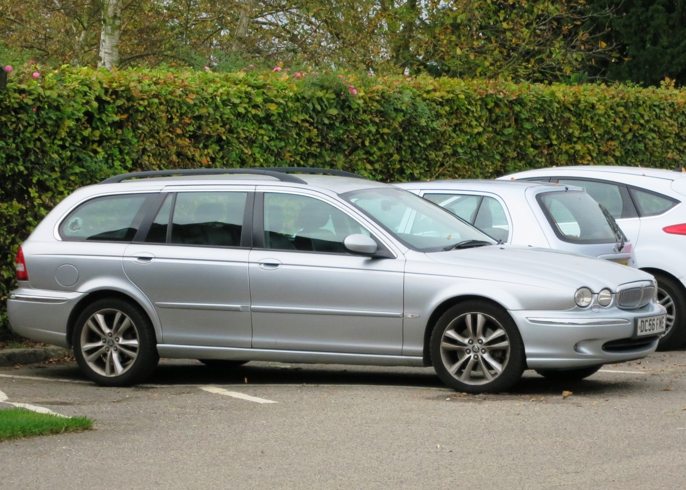 Silver station wagon profile with alloy wheels