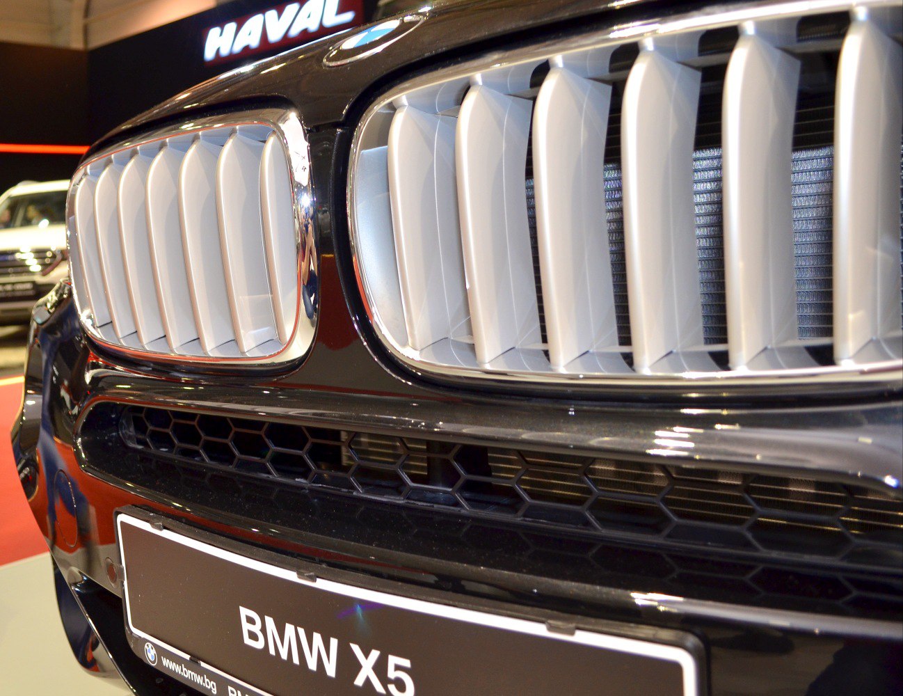 Close-up of BMW car front kidney grille with vertical slats and black chrome surround