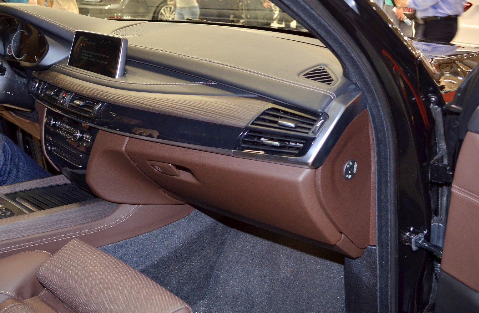 Interior dashboard and center console with leather and wood trim