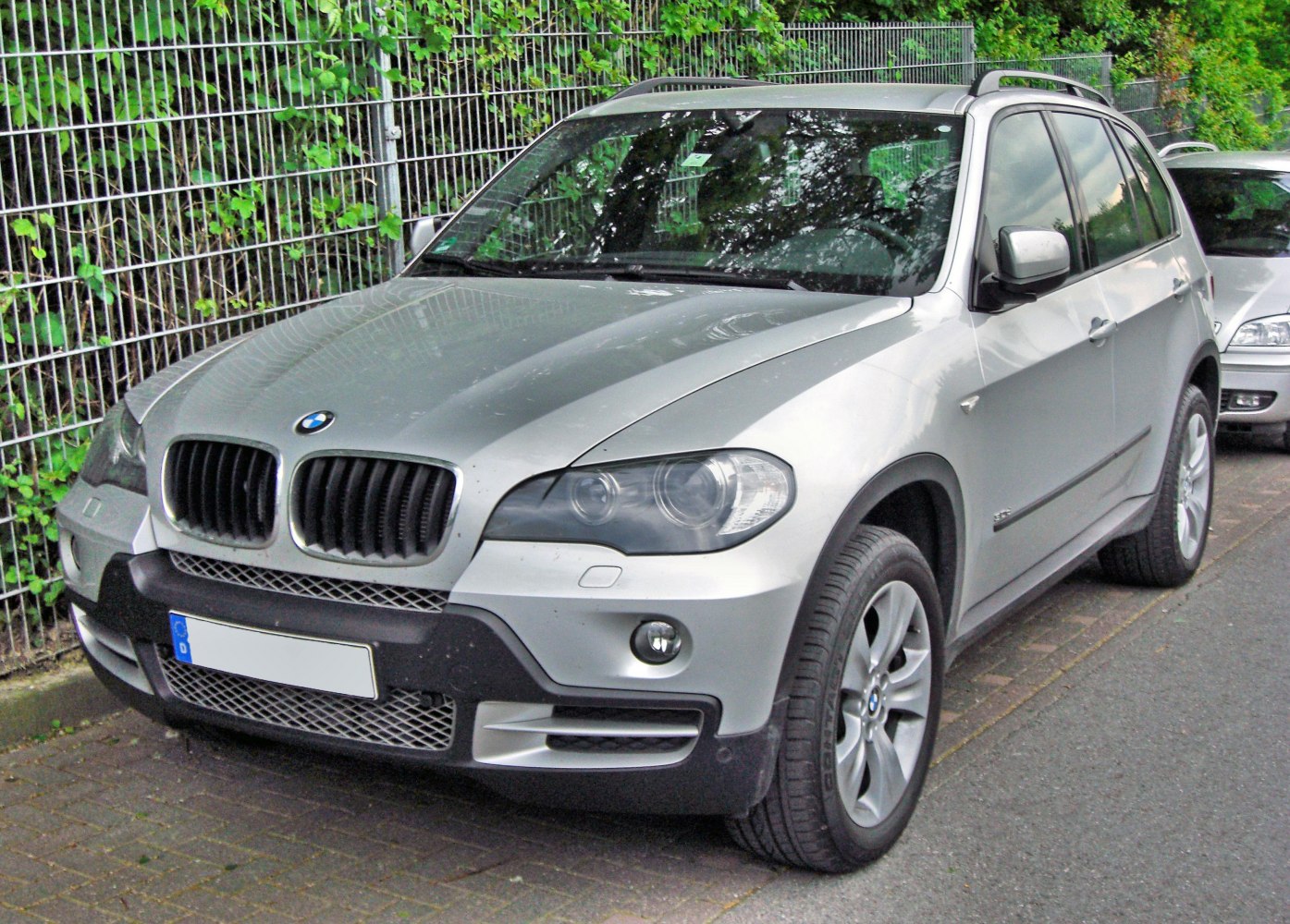 Silver SUV with kidney grille and alloy wheels front side view