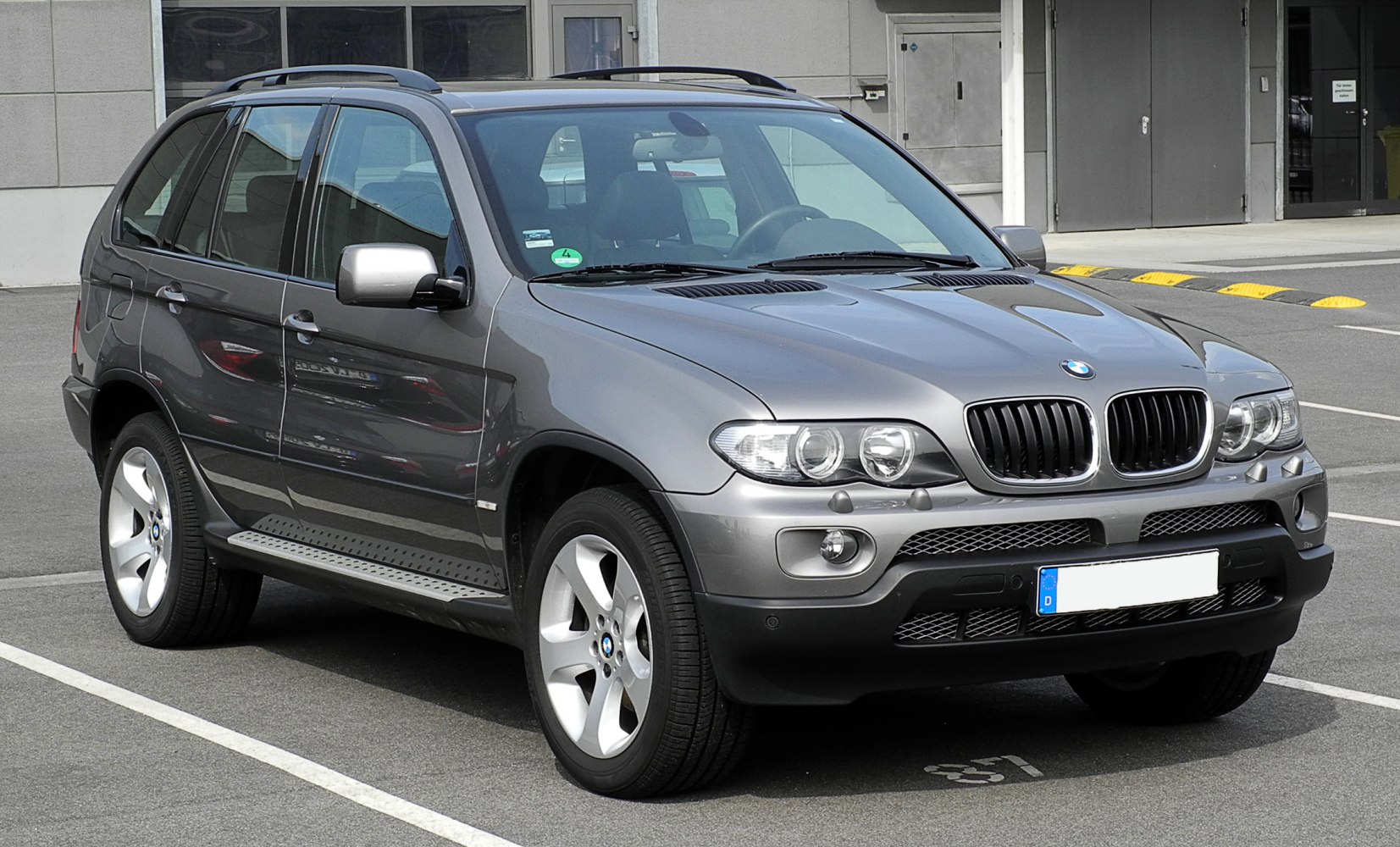 Front view of SUV with dual headlights and alloy wheels