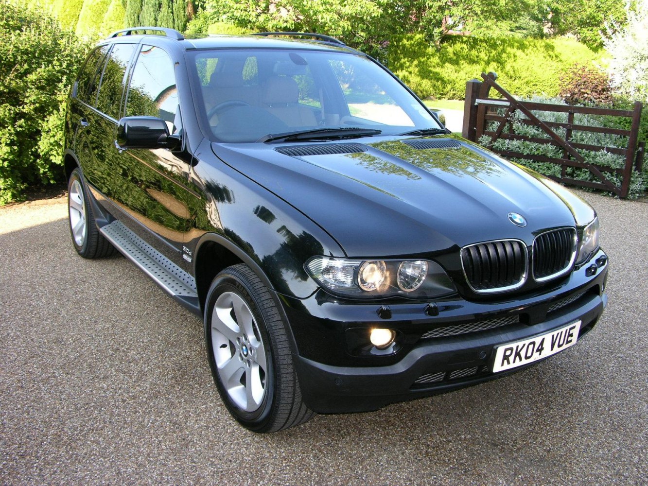 Black SUV with signature kidney grille and dual round headlights