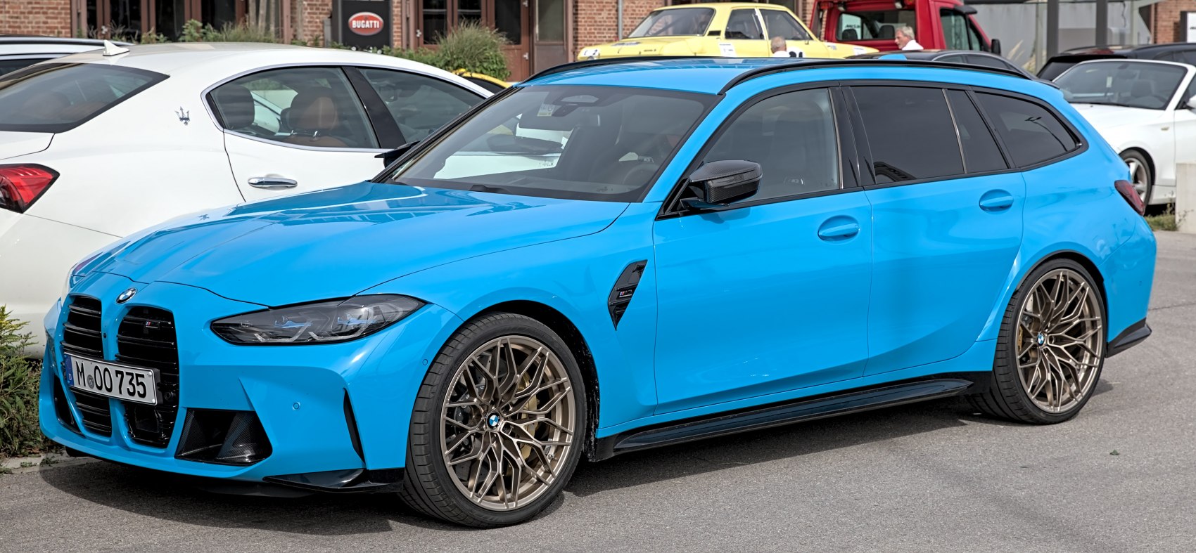 Blue BMW performance wagon with sporty alloy wheels and signature kidney grille