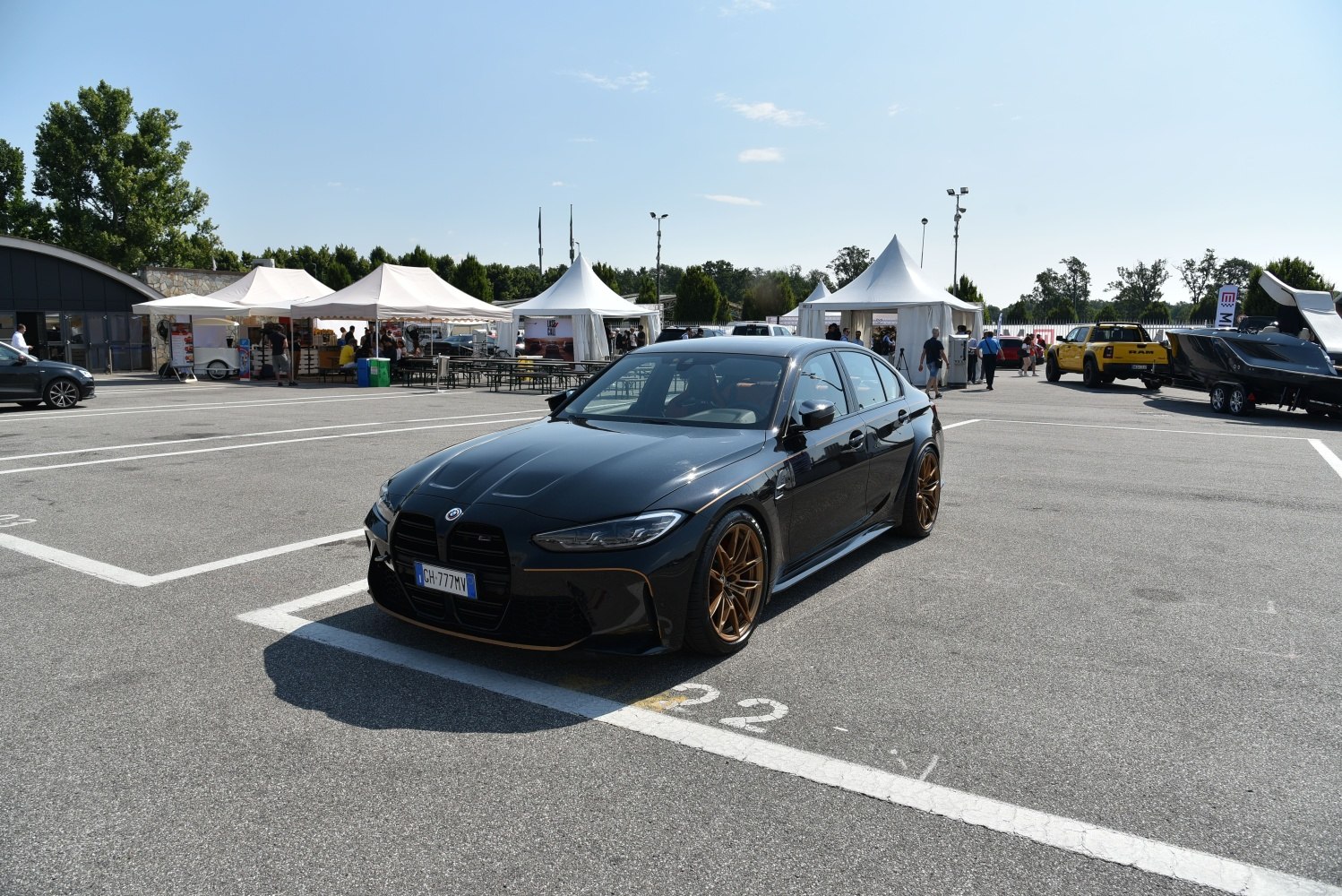 Aggressive front grille and bronze alloy wheels on a performance sedan